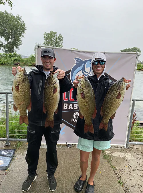 Captain Max and guest holding a big bass