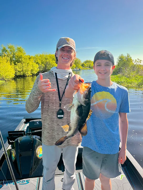 Captain Max and a young fisher with a big fish
