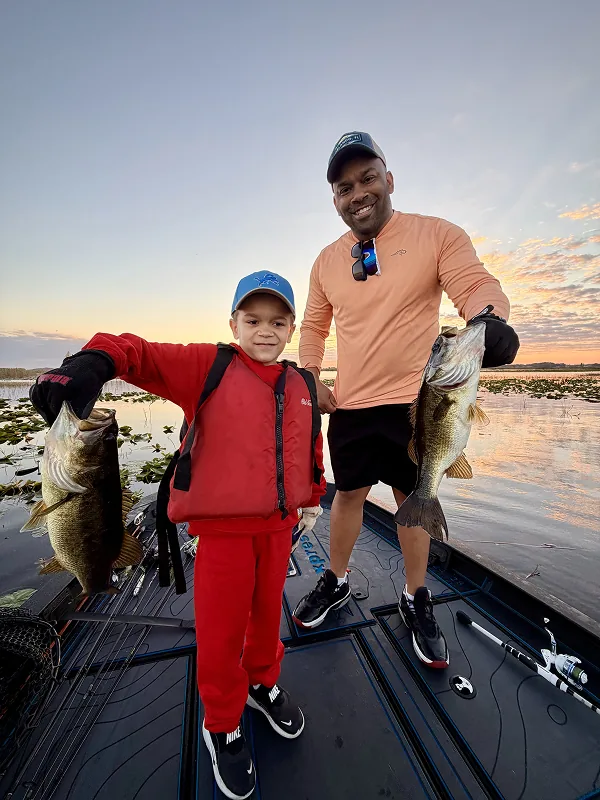 Young boy and his dad on a fishing tour